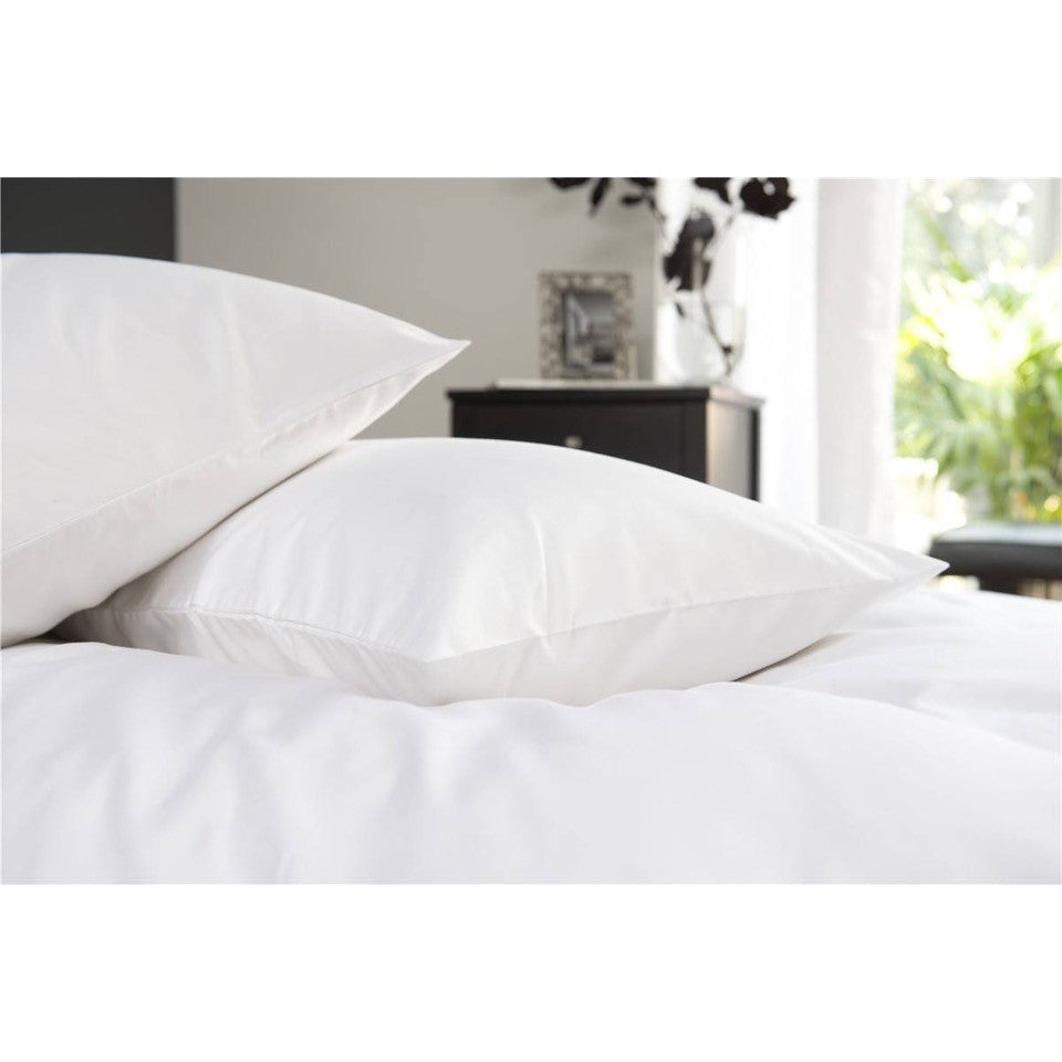Two pillows on a bed with 400 thread count Egyptian Cotton pillowcases