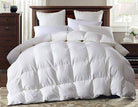 Warm plump Super King size White Goose Down Duvet on a bed with lots of pillows